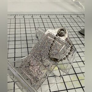 Coach large Clear pink multi color Glitter hang tag with Chain. 3 by 1.5 inches